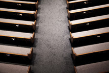 rows of empty pews in a church 