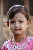 young girl with traditional face paint 