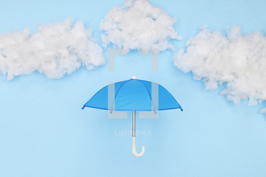 blue umbrella against a blue sky 