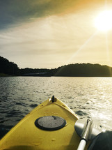 a kayak on the lake at sunrise.