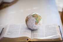 globe on a Bible 