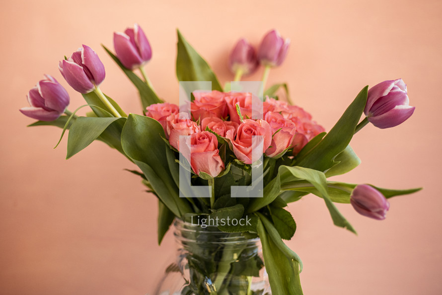 roses and tulips in a vase 