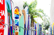 rows of chained up surfboards in Hawaii 
