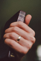 a man gripping a Bible 
