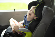 child sleeping in a carseat 