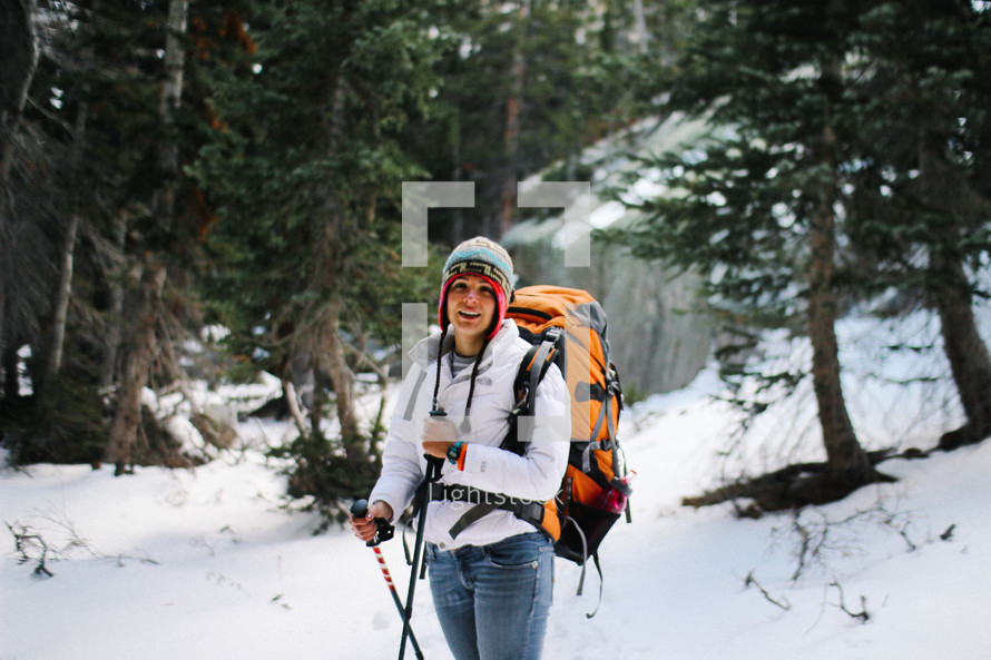 woman backpacking in the snow 