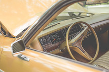 steering wheel on a vintage car 