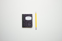 composition book and pencil 