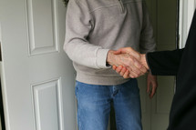 shaking hands with a neighbor 