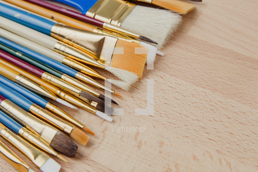 paint brushes on wood