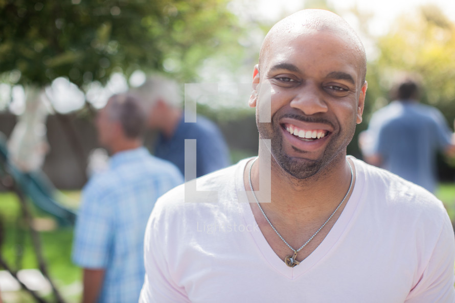 headshot of an African American man at a cookout 