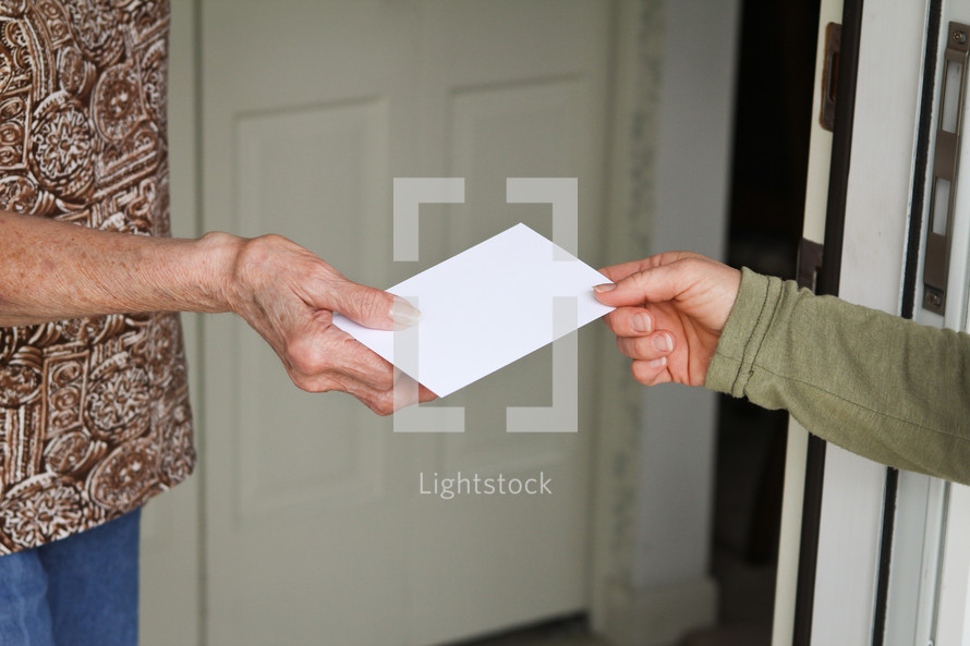 giving an envelope to a neighbor 