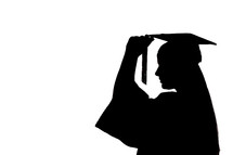 silhouette of a graduate turning her tassel 