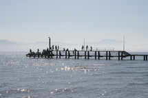 fishermen on a pier 