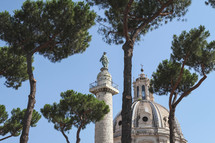 trees and dome on an old cathedral in Italy 