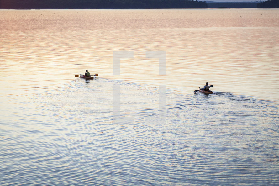 paddling a kayak on a lake 