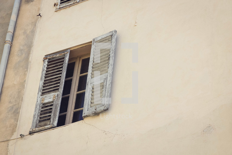 wooden shutters on a window in Italy 