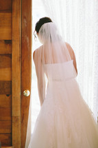 bride looking out a window 