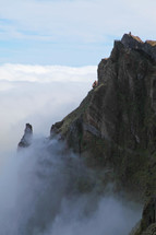 Mountain cliff and fog with view tower