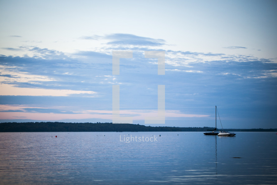 distant sailboat on a lake 