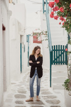 woman standing in an alley in Greece 