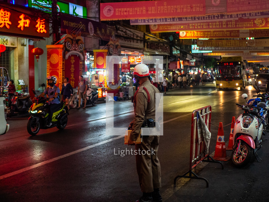 traffic cop in a city at night 