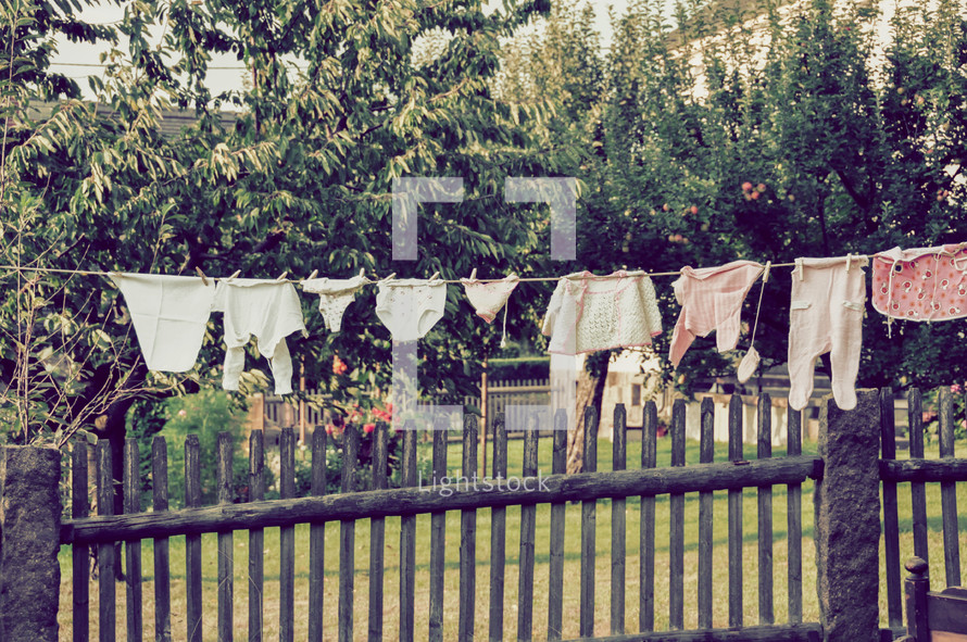 baby clothes on a clothesline 