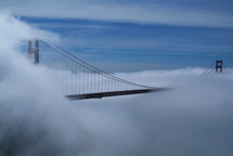 Fog over Golden Gate bridge. Clouds.