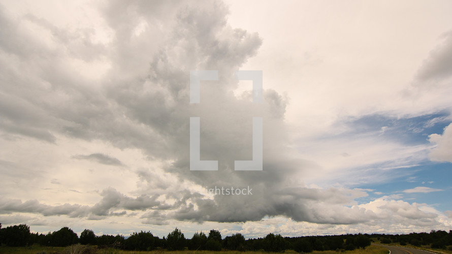 clouds over flat land 