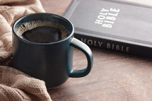 coffee cup and sweater with Bible 