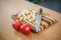 apple pieces on a cutting board 