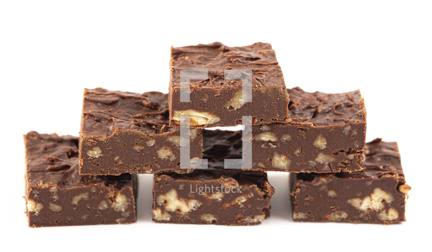 Fudge with walnuts on white background