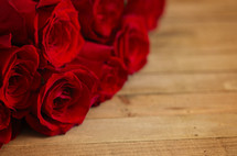 red roses on wood 