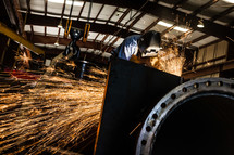 Sparks from a Man welding welder hood steel industrial