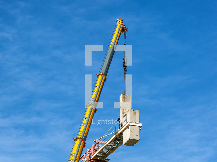 Crane disassembly, separation of components and removal of counterweights.