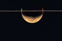 Abstract Half Moon on Laundry Rope in Night Sky