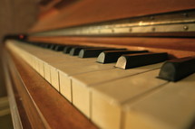 Closeup of ebony and ivory keys on an antique piano