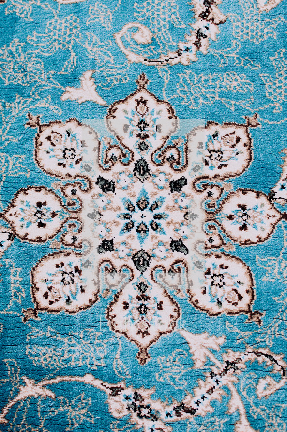 pattern on a teal rug in Oman 