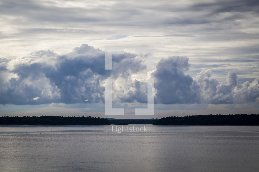 clouds over lake water 