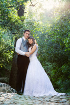 portrait of a bride and groom standing outdoors 