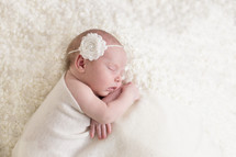 a sleeping newborn girl 