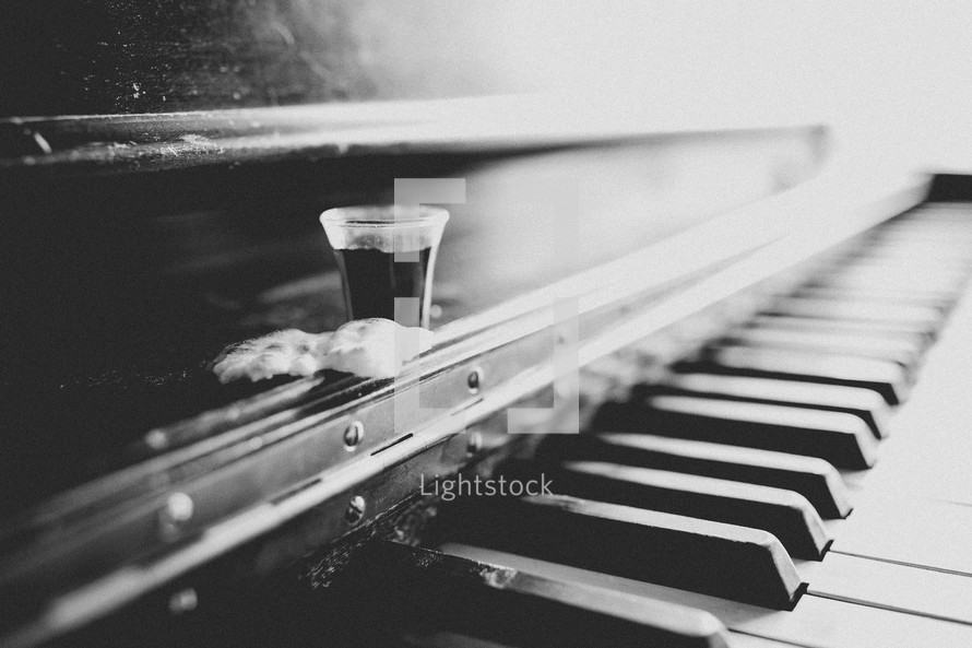 wine and bread on piano for communion