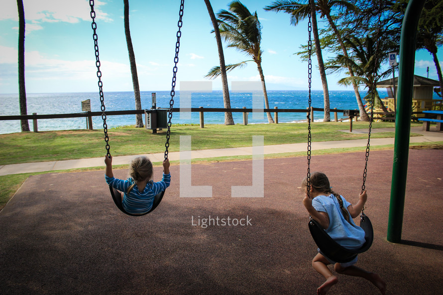 girls on a swing set 