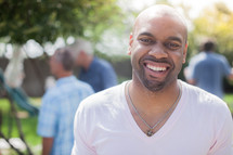 headshot of an African American man at a cookout 