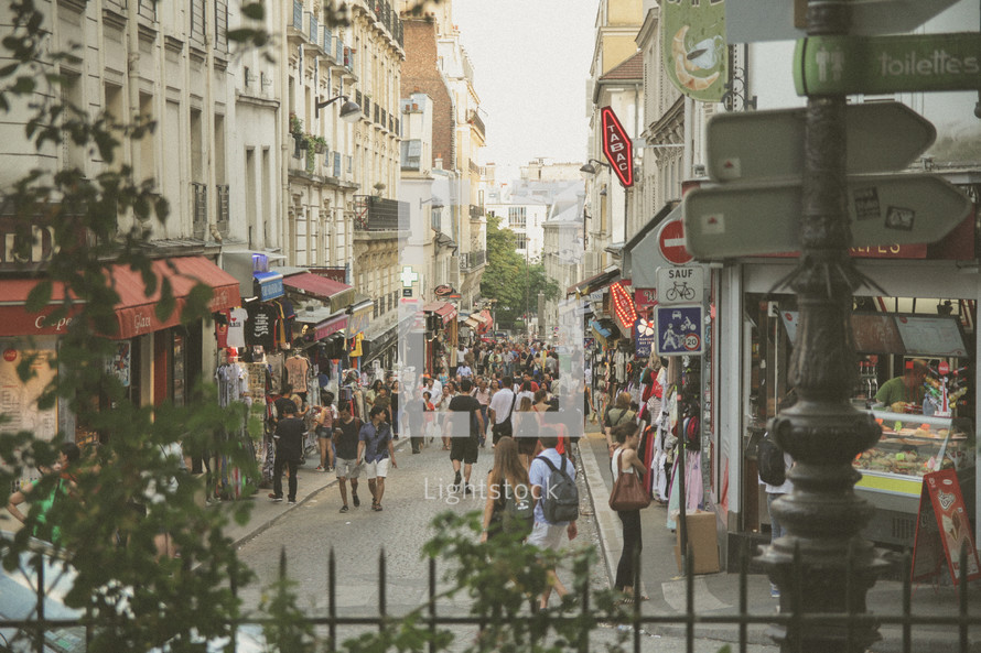 crowds walking down a Paris street 