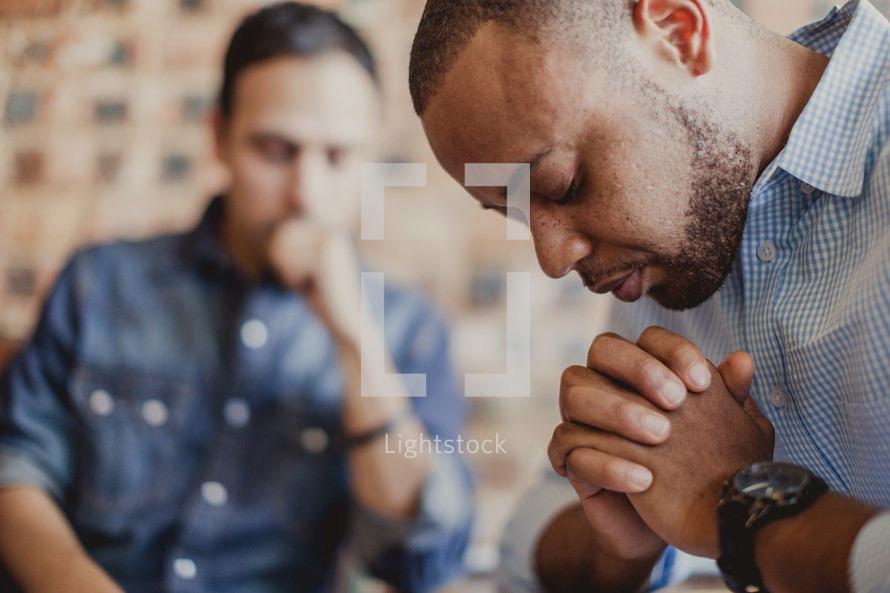 men in prayer at a Prayer group