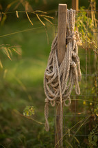 rope hanging on a fence post