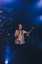 woman singing during a worship service 