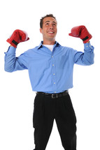 man wearing boxing gloves and dress clothes 