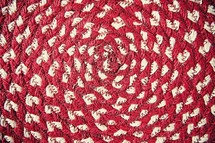 red and white circular rug 